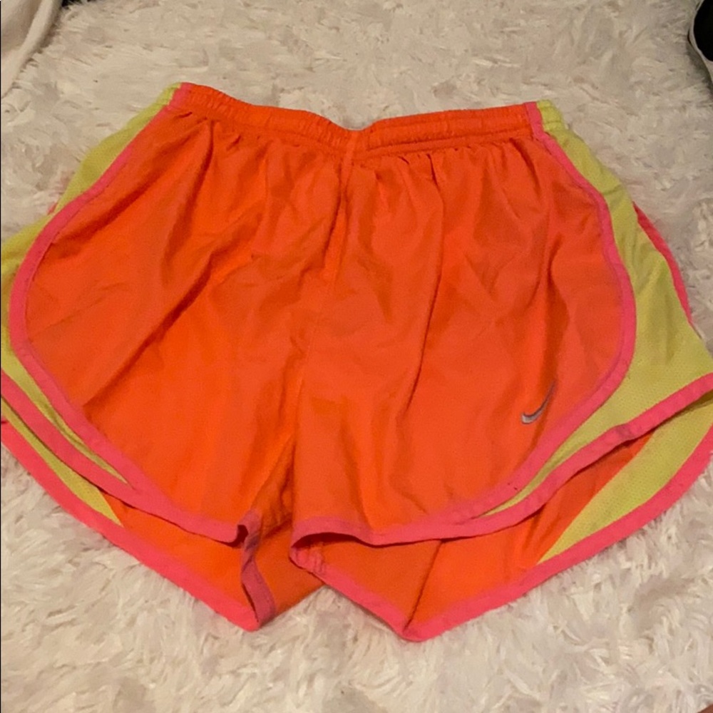 Women’s bright orange Nike shorts
